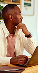 Creative, idea and man with laptop in office, copywriting and planning for article or contemplating. Serious, copywriter and black person with technology, email marketing and decision in business