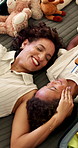 Love, mother or boy in bedroom with smile, childcare or bonding together with comfort. Above, cozy or African family in home with emotional security, tender moment or trust in happy relationship.