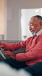 Senior, man and typing in home with tablet, internet connectivity and laugh for funny text message. Bokeh, flare and happy elderly person in lounge with tech, website and meme from social media app.