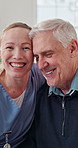 Support, nurse and old man in house with face, understanding and bonding in elderly care. Security, happy caregiver or senior person with embrace, patient connection and compassion in retirement home