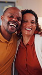 Face, couple and smile in home with hug, love and partner affection for weekend break. Portrait, interracial people or laughing in lounge with embrace, connection and healthy commitment for wellness