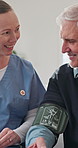 Nurse, happy and old man with test for blood pressure, hypertension diagnosis and monitor heart. Caregiver, help and senior resident in nursing home for cardiovascular exam with smile for results