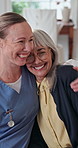 Support, nurse and old woman in home with smile, understanding or bonding in elderly care. Security, caregiver or senior person with hug, patient connection or happy relationship in retirement.
