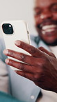 Man, hand and laugh in house with phone, funny online news and meme from text message notification. Happy, black person and browsing on sofa with tech, internet connection and joke from social media.