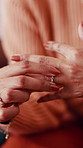 Senior, woman and hands with ring for regret, doubt or grief with loss or loneliness in retirement home. Closeup, female person or fidget with jewelry or widow for mourning sorrow, sadness or pain
