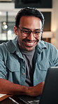Happy, man and typing in office with laptop, good news and approval for AI advertising campaign. Person, smile and research in business with computer, glasses and innovation for digital marketing.