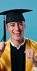 Face, graduation and man in studio pointing for education, achievement and college success. Graduate, portrait and person with applause for milestone, university and celebrate on blue background