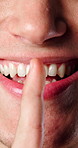 Person, hands and lips with secret for mischief plan, whisper or conspiracy scheme for malicious plot. Closeup, mouth and smile with sneaky expression for silence, quiet or mysterious vendetta