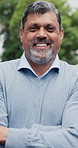 Crossed arms, happy and face of businessman in city with confidence for finance career outdoor. Smile, professional and portrait of mature financial manager with pride for corporate about us in town.