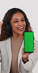 Phone, smile and woman in studio with green screen for call center, contact us or space for news. Mockup, happy and person with headset, tech or approve emoji for customer service on white background