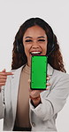Phone, pointing and woman in studio with green screen for call center, contact us or space for news. Mockup, happy person and headset with tech for Okay emoji or customer service on white background