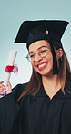 Success, face or graduate with diploma, college goal or excited in academic achievement. Happy, woman or university student with certificate, celebration or education milestone on studio background.