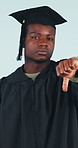Face, thumbs down and man in studio with graduation review, no and negative feedback. Graduate, black person and dislike sign, education disappointment and student loan challenge on background