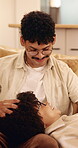 Relax, couple and head massage on home sofa with love, connection and support or care. Man, woman or people with glasses on lounge couch with comfort, pamper and happy with communication in house