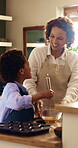 Baking, mom and child with mixing in home for cookies ingredients, recipe help and development. African family, happy mother and boy with whisk for muffin snack mixture, culinary skills and guidance
