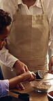 Baking, parent and child with flour in mixing bowl for cake process, teaching family recipe or help. Mom, son and guidance with batter mixture in home for cookies preparation, development or learning