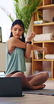 Fitness, stretching and woman with laptop in house, physical activity and watching yoga tips on app. Warm up routine, home and person with technology, serious and self care tutorial on social media