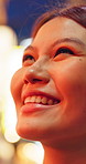 Happy, thinking and asian woman in night city for tourism, outdoor travel or sightseeing trip. Thoughtful, female person or wonder with smile, wonder or view in late evening for fun memory or moment