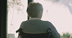Thinking, elderly and woman in wheelchair by window with recovery hope, relax and vision. Retirement, back and person with disability, reflection and view with sunshine for rehabilitation in home