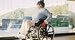 Happy, wheelchair and old woman in home with mobility, contemplating and nostalgia. Retirement, reflection and senior person with disability in house with view, moving wheels and space by window