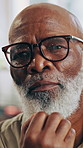 Serious, thinking and senior black man in home with glasses, contemplation and retirement planning. Calm, African person and pensioner in house with reflection, spectacles and decision for future.