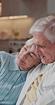 Comforting, sad and old couple in house with hug, understanding or bonding with partner empathy. Security, unhappy or senior people with embrace, romantic support and tender moment in retirement.
