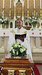 Senior, priest or bible at funeral in church for spiritual comfort, final testament or blessing. Coffin, old man or reading scripture at burial service for sacred tradition, catholic sermon or preach