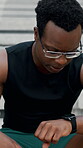 Smart watch, fitness and breathing with black man on steps for workout break, tracking heart rate and check. Health app, exercise rest and tired with person outdoor for runner performance and stats
