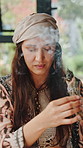 Woman, herbs and meditation with incense for healing, aromatherapy and ritual for mindfulness. Healer, eyes closed or sage smoke at house for spiritual cleanse traditional medicine and holistic detox