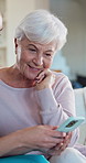 Caregiver, help and old woman in house with phone, social media app and smile for website navigation. Happy, nurse and senior person in home with tech setup, scroll and assistance for digital news.
