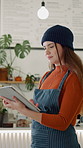 Typing, tablet and woman in coffee shop for online menu, inventory checklist and digital orders. Restaurant, manager and person on tech for cafe website, review and stock for hospitality service