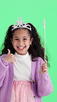 Face, wand and child with thumbs up on green screen for playing, pretend and costume success. Portrait, happy and girl with smile, crown and toy for fun, games and fantasy on chromakey background