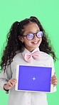 Face, child or girl with tablet on green screen for marketing on a studio background. Portrait, kid or presentation with smile, technology display or chromakey for online advertising on mockup space
