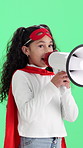 Girl, superhero and costume with megaphone on green screen for role play on a studio background. Child, kid or talking with bullhorn or loudspeaker in hero cosplay for dress up or announcement