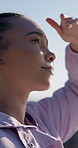 Hiking, woman and view on vacation outdoor, sightseeing or thinking on adventure with happiness. Smile, tourist and person in nature for holiday, trekking and reflection for travel with wanderlust