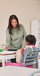 Education, children and teacher in classroom at elementary school for help, teaching or growth. Professional, exam and educator with students for development, test or assignment for learning.