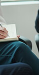 Hands, meeting and pen with business person in office for checklist, development or schedule. Diary, notebook and writing with employee group in corporate workplace for agenda, notes or workshop