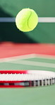 Tennis court, racket and ball in air for sport, competition and action or activity for match. Outdoor, bounce and object for game, equipment and training for contest, fitness and exercise challenge
