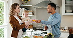 Cheers, food and parents with baby in kitchen of home for bonding, healthy diet or nutrition. Child development, meal preparation and toast with happy family in apartment together for growth