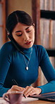Laptop, phone call and Asian woman with notebook in home office, remote work or publication schedule. Author, tech or Japanese person writing notes for freelance information, talk or manuscript list