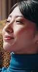 Thinking, smile or woman in home with nostalgia, relaxing moment or mindfulness on weekend break. Reflection, calm or Asian person in house with rest, happy memory or peaceful perspective on day off.