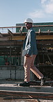 Walking, man and construction worker on rooftop at site for inspection, maintenance or repairs. Project, contractor and civil engineer by scaffolding for renovation, building or quality assurance.
