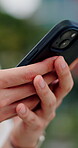 Texting, phone and hands in town with connection, online communication or chat on social media app. Space, typing and man outdoor with tech, message notification and chatting on digital platform.