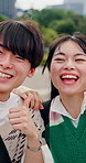 Couple, wave and smile in city for selfie, recording video and travel blog with live streaming. Influencer, excited and asian people outdoor for photography, excursion and holiday vlog in Japan