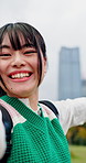 Face, Asian woman and smile in city for selfie, recording video and travel blog with live streaming. Influencer, excited and outdoor for photography POV, landmark excursion and holiday vlog in Japan