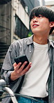 Phone, bicycle and search with man in city for location, digital map and travel. Social media, cycling break and mobile app with Japanese person and bike for networking, connection and adventure