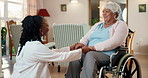 Support, doctor and holding hands with old woman in wheelchair, healthcare and homecare visit. Medical worker, checkup or person with disability, talk and laugh at funny joke with trust in retirement