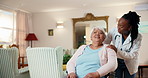 Help, doctor and old woman in wheelchair in home, healthcare support and visit with conversation. Medical worker, push and happy person with disability, care or pointing with assistance in retirement