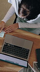 Businesswoman, writing and research with laptop in office, above and plan for investment opportunity. Business, wealth management and person with notes, online and financial report with technology