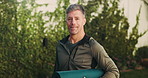 Yoga mat, fitness and face of man in nature with confidence for exercise, health or wellness. Morning, happy and portrait of mature person with equipment for pilates, calm or relax outdoor in park.